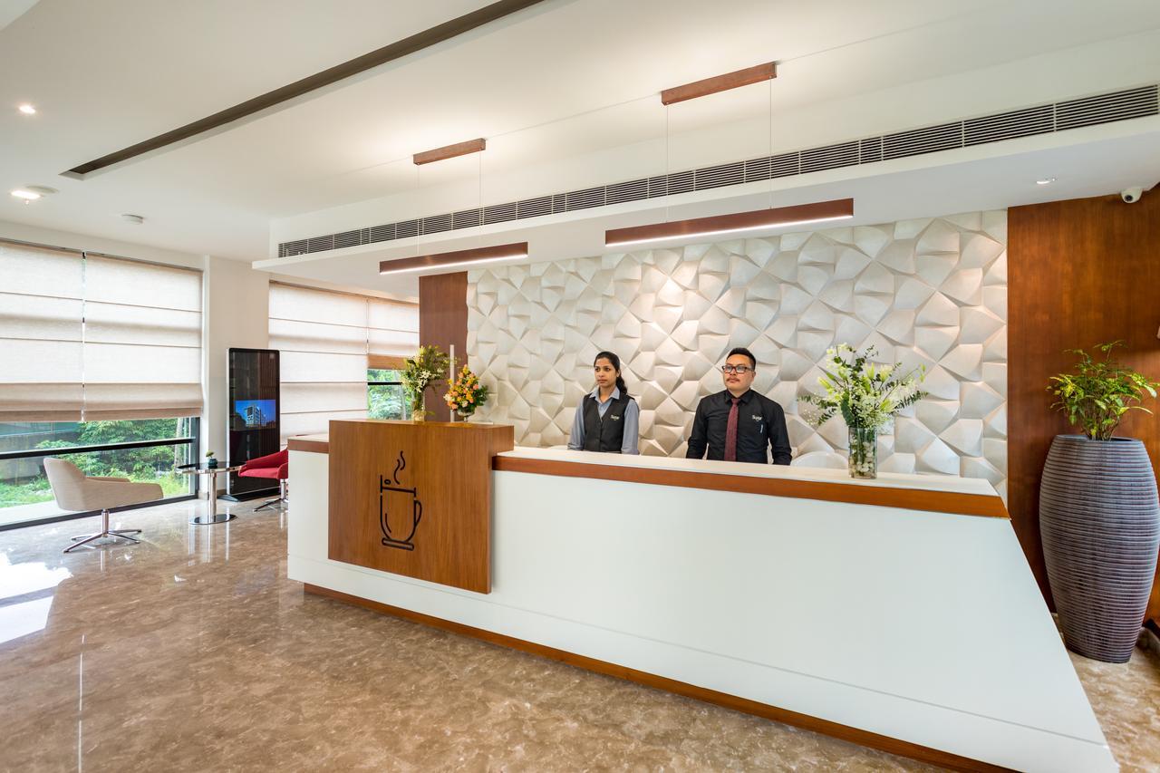 Sugar Business Hotel Kochi Bagian luar foto