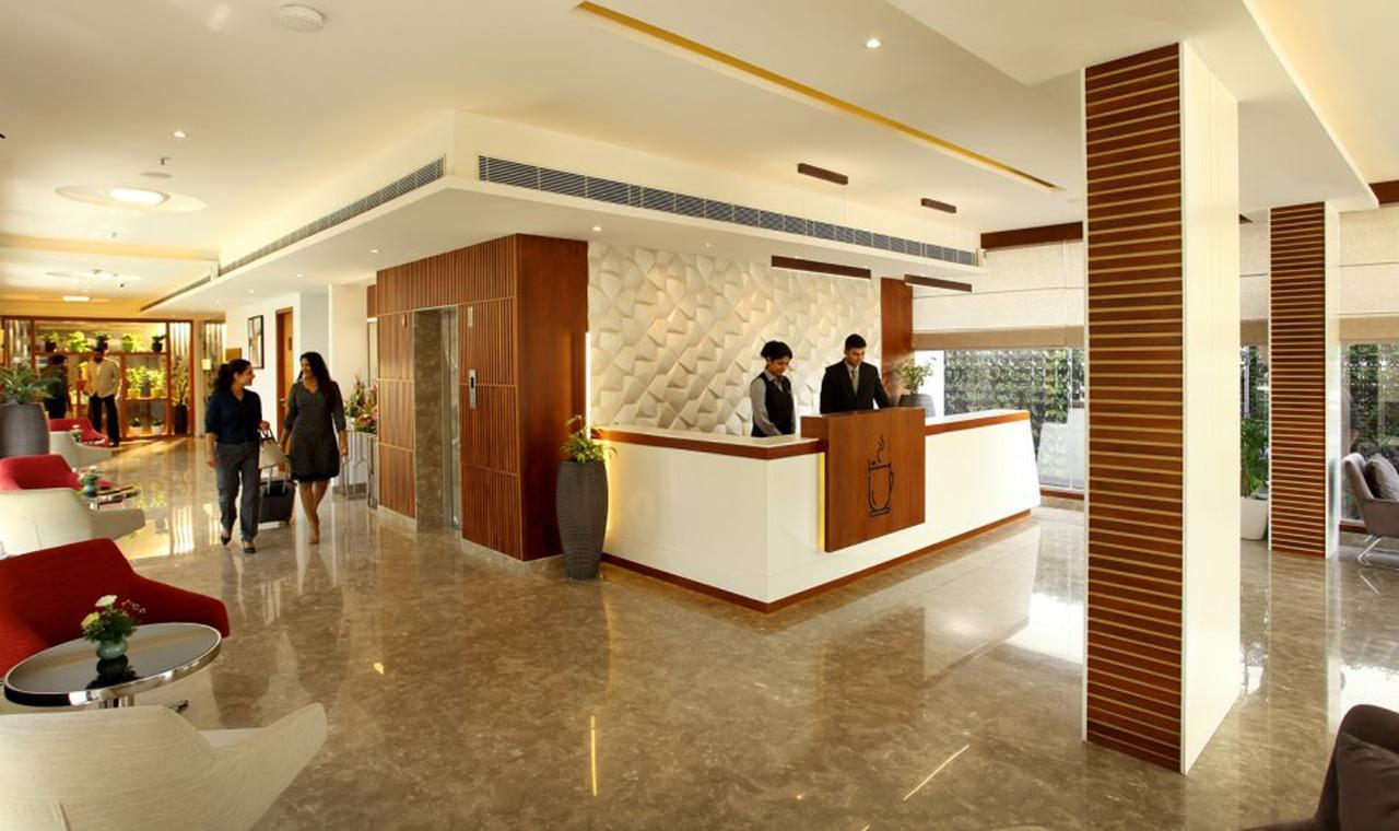 Sugar Business Hotel Kochi Bagian luar foto